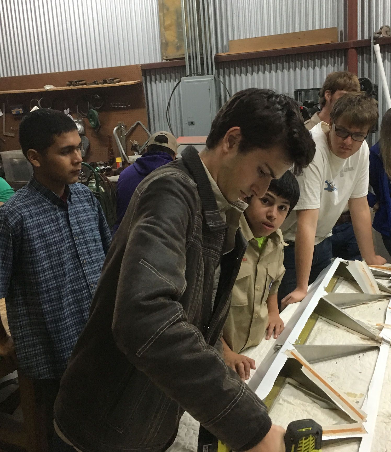 scouts working on making an airplane wing