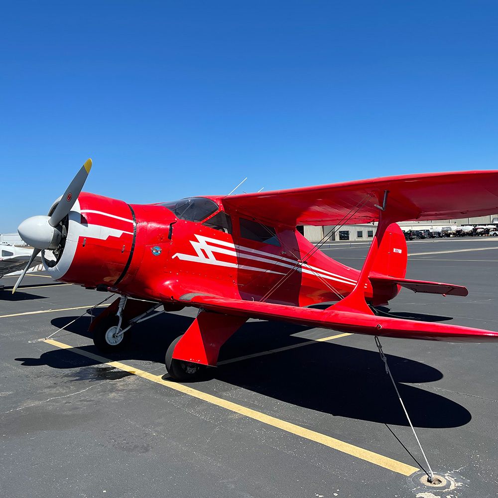 red and white beechs staggerwing on the tarmac